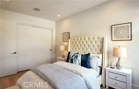 a bedroom with a bed and chair