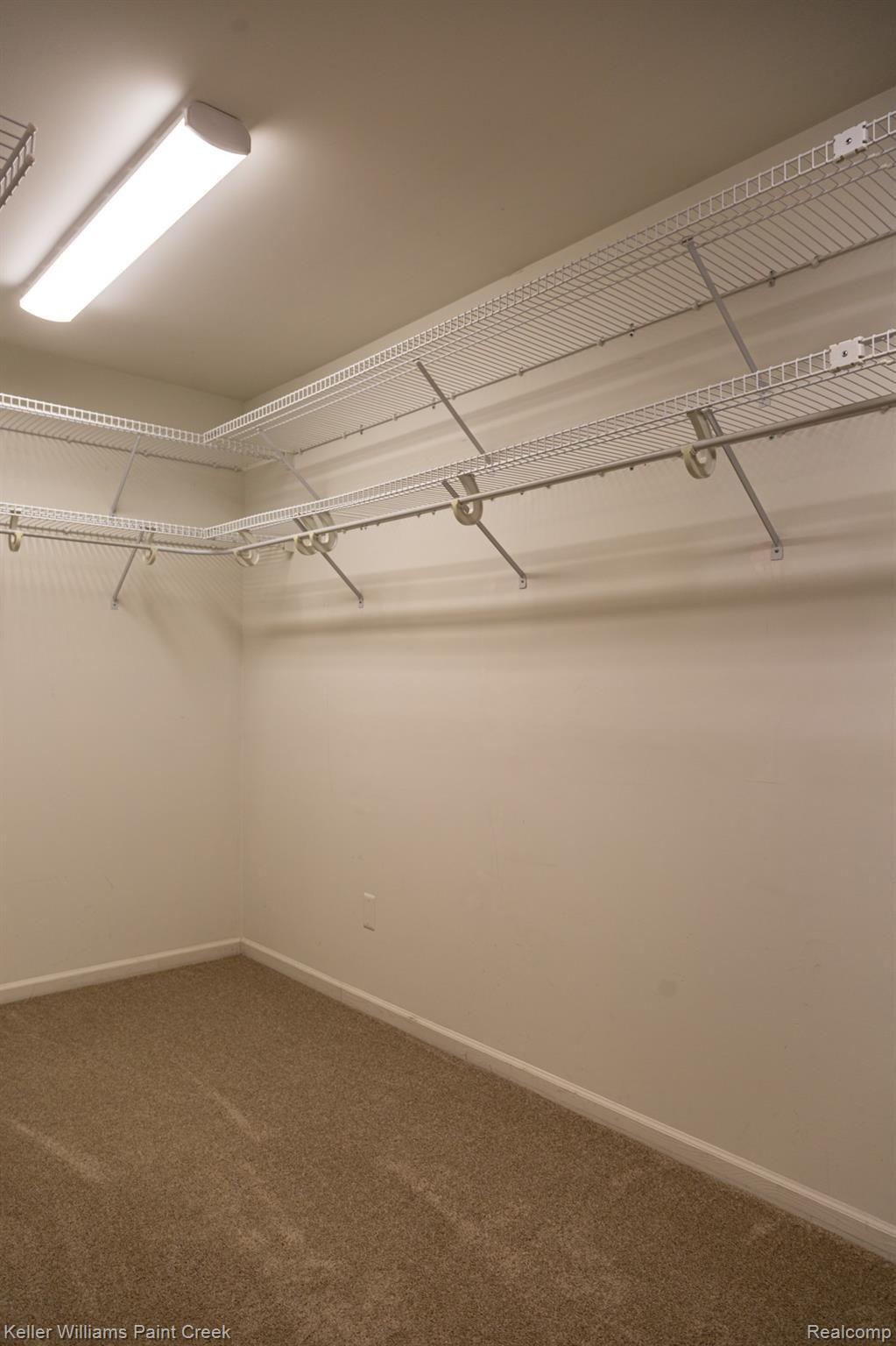 2452 Pleasant View Drive Rochester, MI 48306 - Photo 11 of 52 HUGE walk-in master closet w/LED lighting & custom shelving!