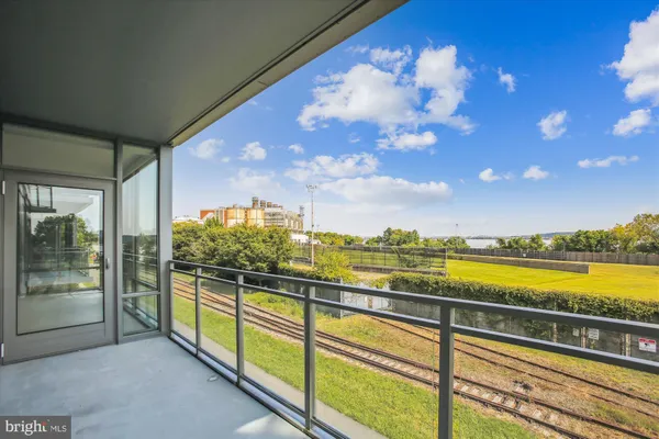 a view of swimming pool with seating area