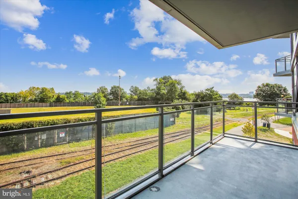 a kitchen with granite countertop a sink and cabinets