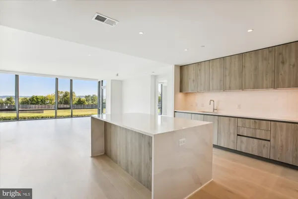 a bedroom with a bed table and window