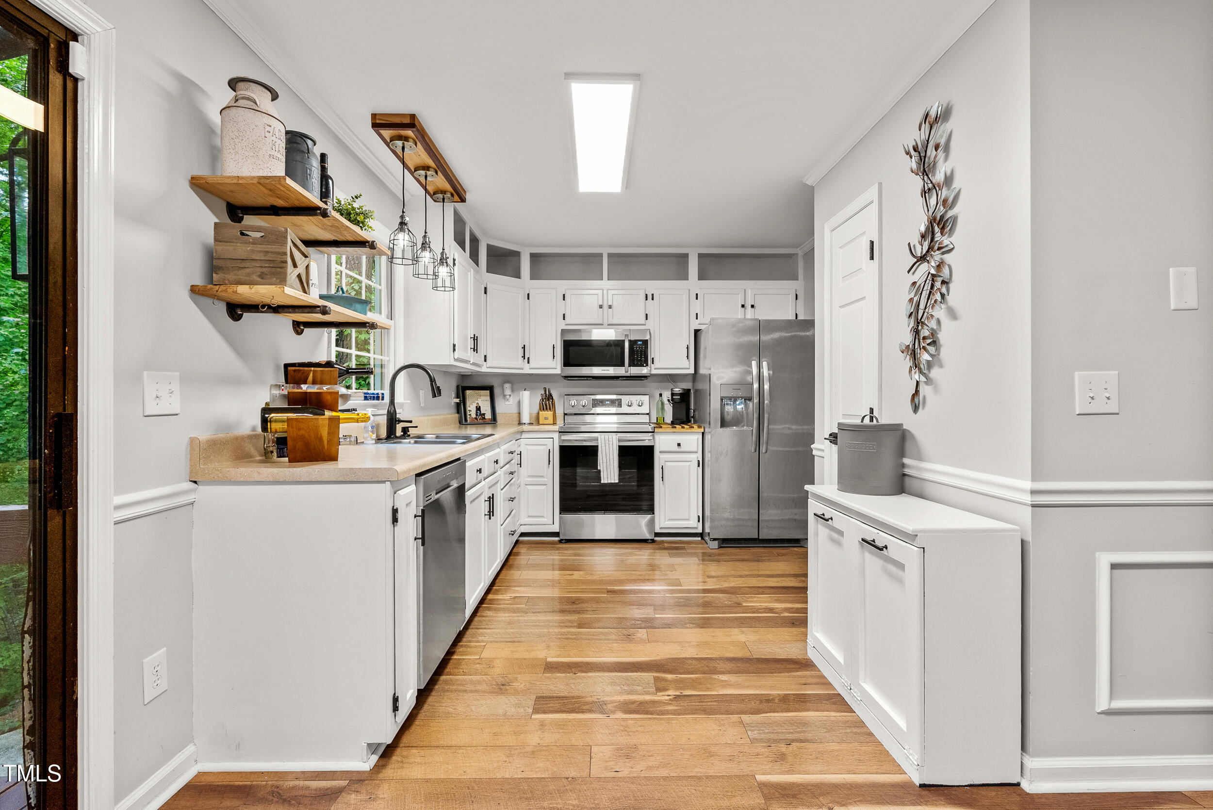5701 Hadrian Drive Durham, NC 27703 - Photo 13 of 41 a kitchen with stainless steel appliances granite countertop a refrigerator and a stove