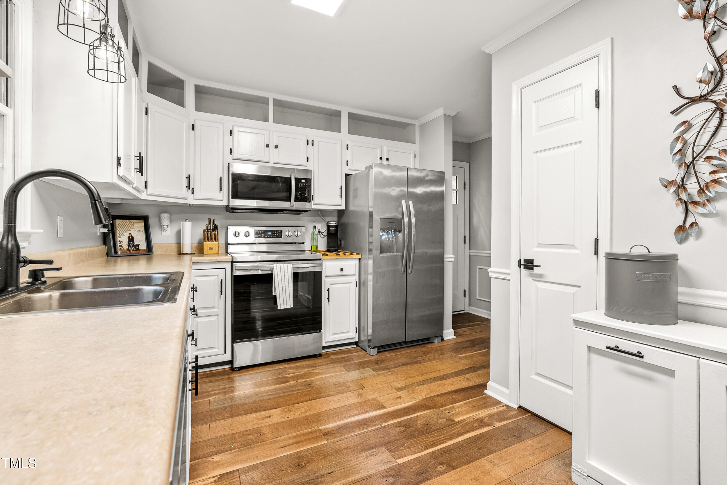 5701 Hadrian Drive Durham, NC 27703 - Photo 14 of 41 a kitchen with a refrigerator sink and stove