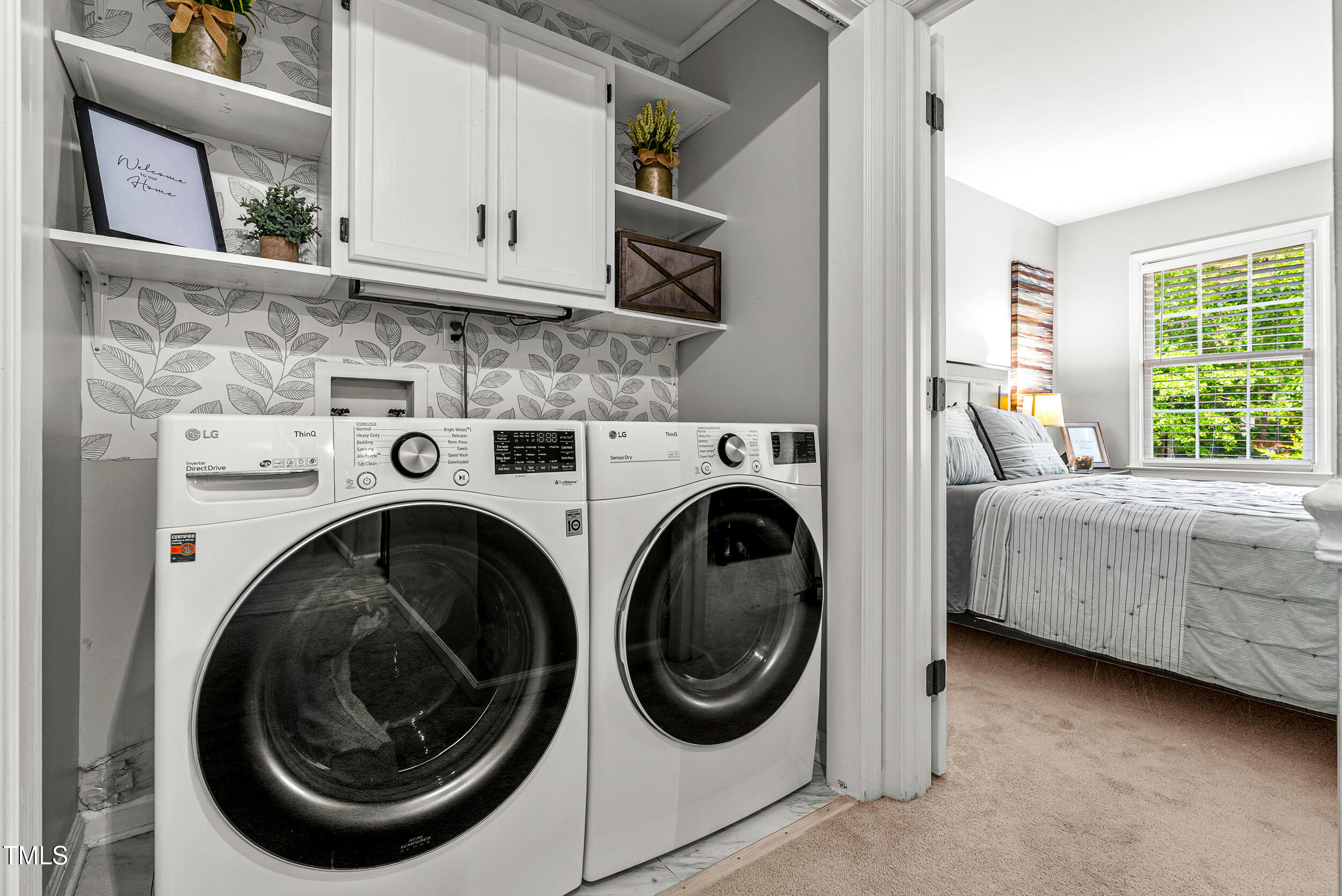 5701 Hadrian Drive Durham, NC 27703 - Photo 20 of 41 a bedroom with bed and cabinets