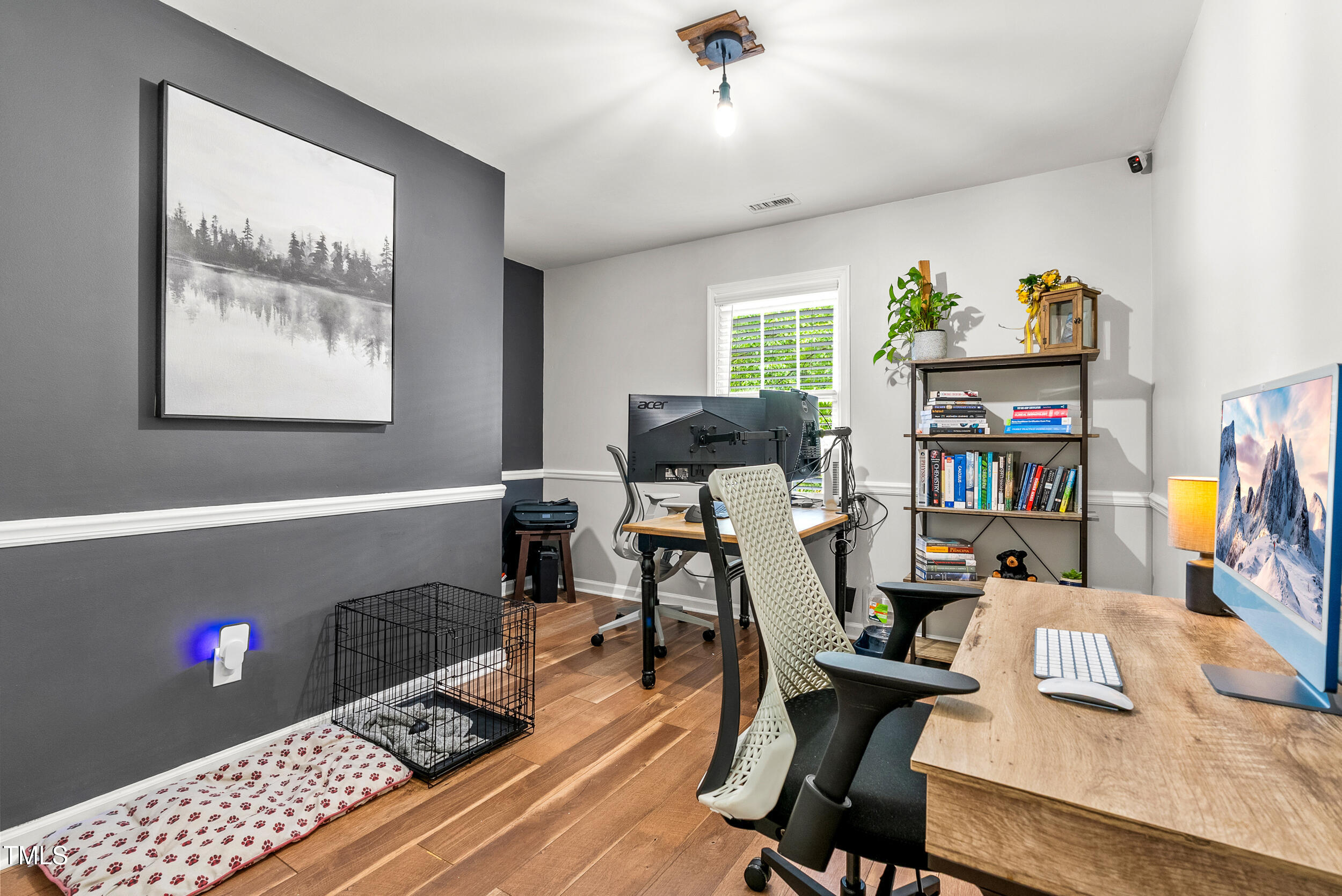 5701 Hadrian Drive Durham, NC 27703 - Photo 25 of 41 a view of a workspace with furniture and a window