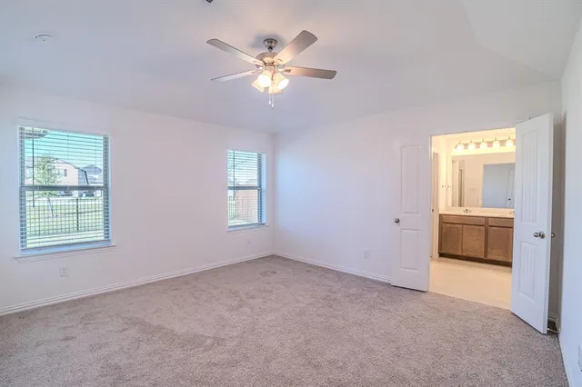 a kitchen with a refrigerator and a sink