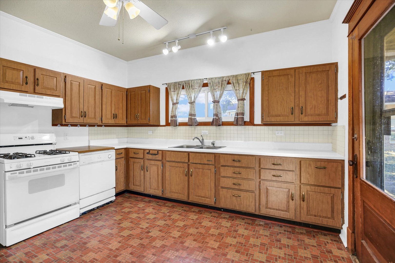 206 Illinois Street Mansfield, IL 61854 - Photo 35 of 74 a kitchen with granite countertop cabinets stainless steel appliances and a counter space