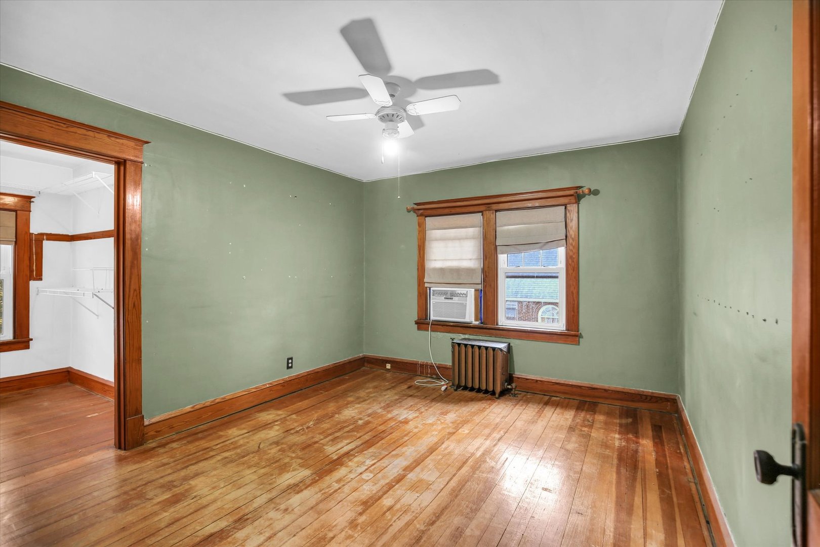 206 Illinois Street Mansfield, IL 61854 - Photo 42 of 74 an empty room with wooden floor and windows
