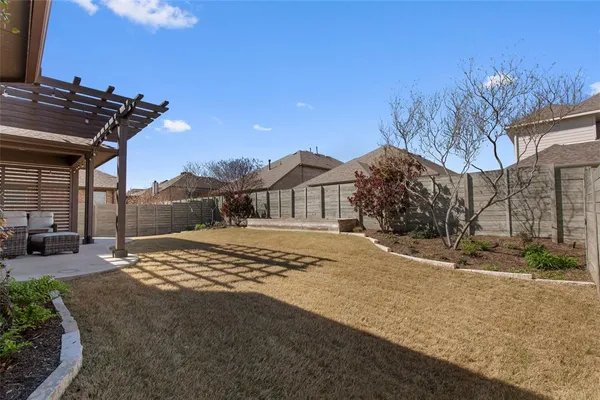 a view of a backyard of the house
