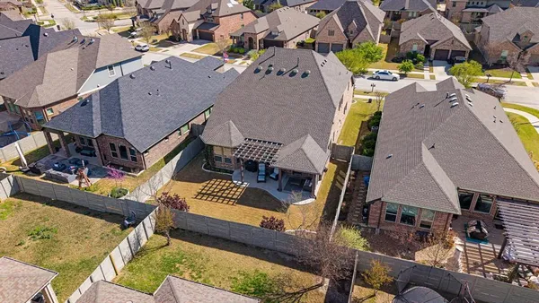 a view of a house with a snow on the road