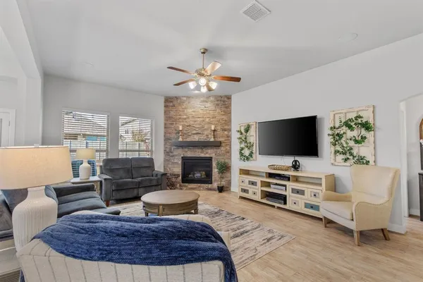 a large kitchen with a table and chairs