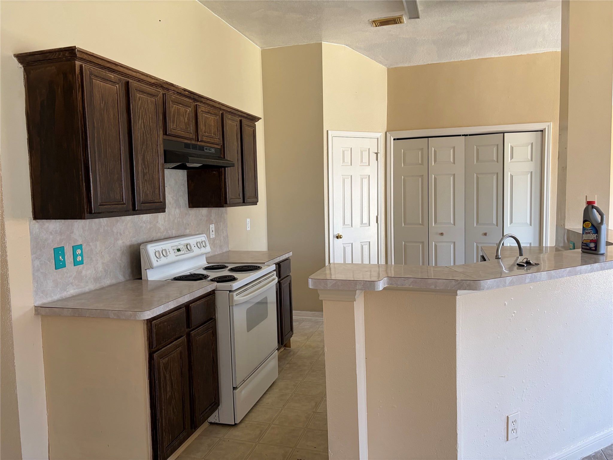 15738 Boonridge Road Houston, TX 77053 - Photo 13 of 22 a kitchen with stainless steel appliances granite countertop a stove a sink and a microwave