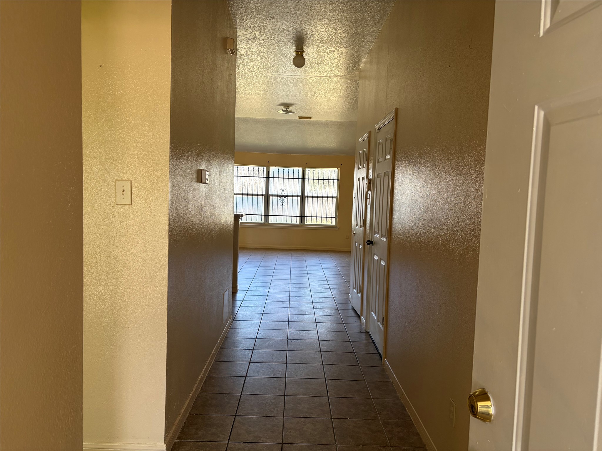 15738 Boonridge Road Houston, TX 77053 - Photo 6 of 22 a view of a hallway with wooden floor and a bathroom