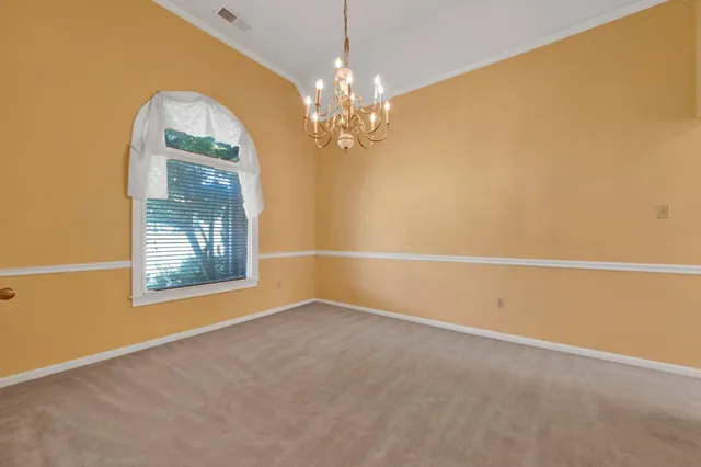 a kitchen with stainless steel appliances granite countertop a sink a stove and a microwave