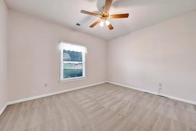 a bathroom with a toilet and a bathtub