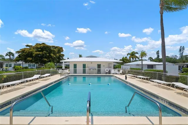 a view of a swimming pool with a patio