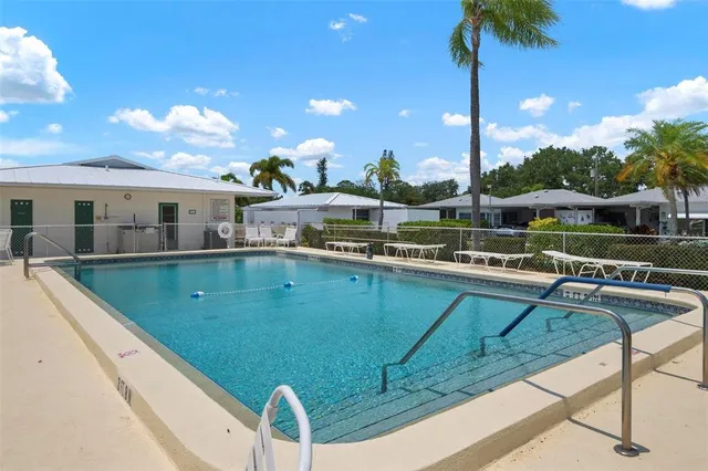 a view of a swimming pool with a patio