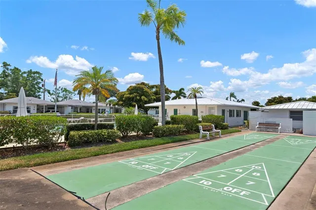 a front view of a house with a yard table and chairs