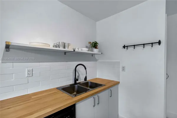 a kitchen with a sink and cabinets