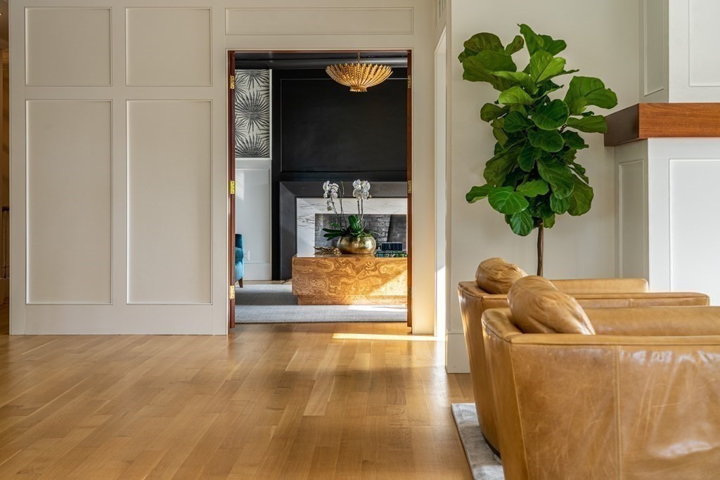 21 Jarvis Avenue Hingham, MA 02043 - Photo 11 of 30 a living room with furniture and a potted plant