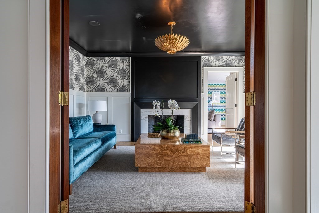 21 Jarvis Avenue Hingham, MA 02043 - Photo 12 of 30 a living room with furniture and a fireplace