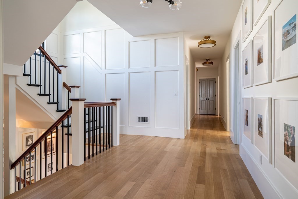 21 Jarvis Avenue Hingham, MA 02043 - Photo 16 of 30 a view of a hallway with wooden floor and entryway