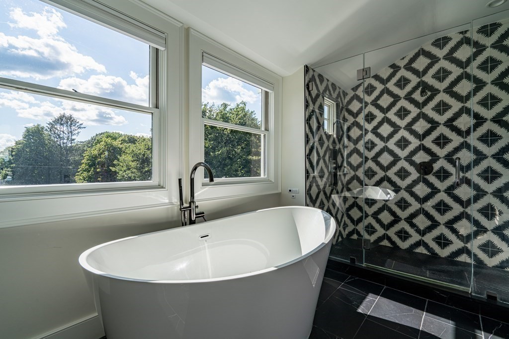 21 Jarvis Avenue Hingham, MA 02043 - Photo 19 of 30 a white bath tub sitting next to a window