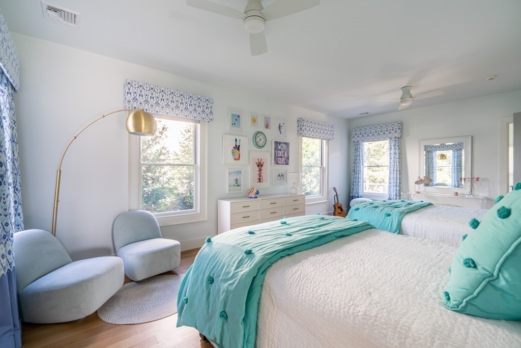 21 Jarvis Avenue Hingham, MA 02043 - Photo 20 of 30 a bedroom with bed couch and windows