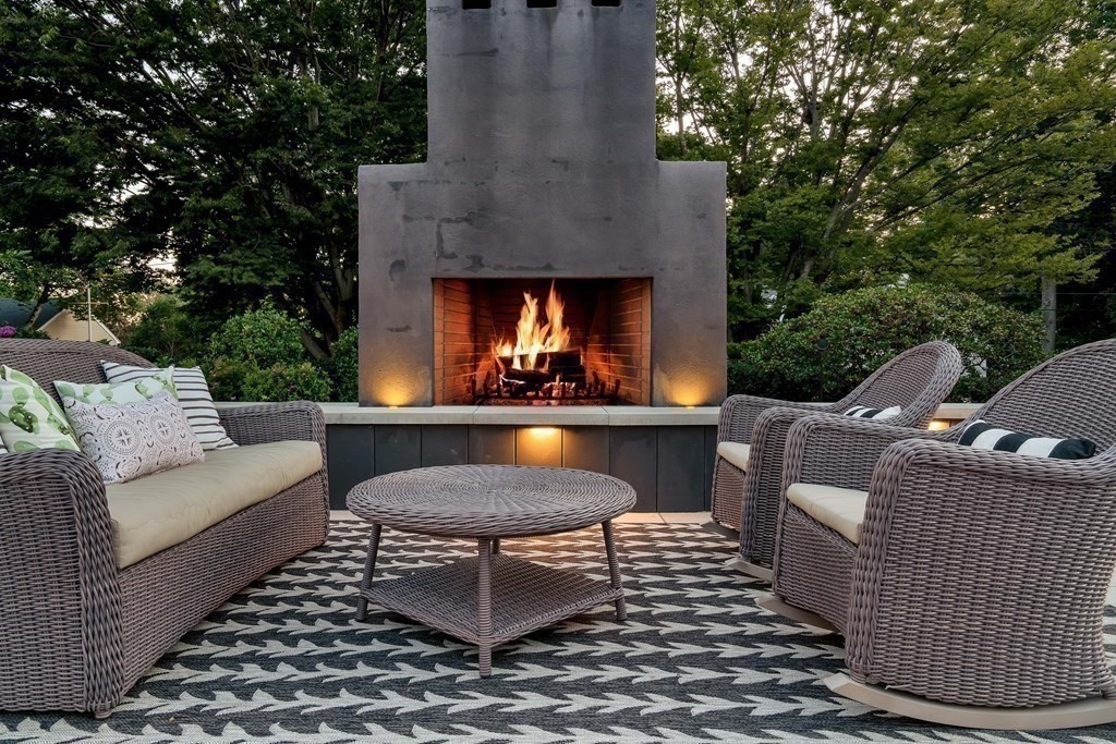 21 Jarvis Avenue Hingham, MA 02043 - Photo 27 of 30 a view of a patio with couches table and chairs and potted plants