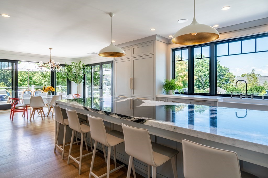 21 Jarvis Avenue Hingham, MA 02043 - Photo 6 of 30 a kitchen with a large window and cabinets