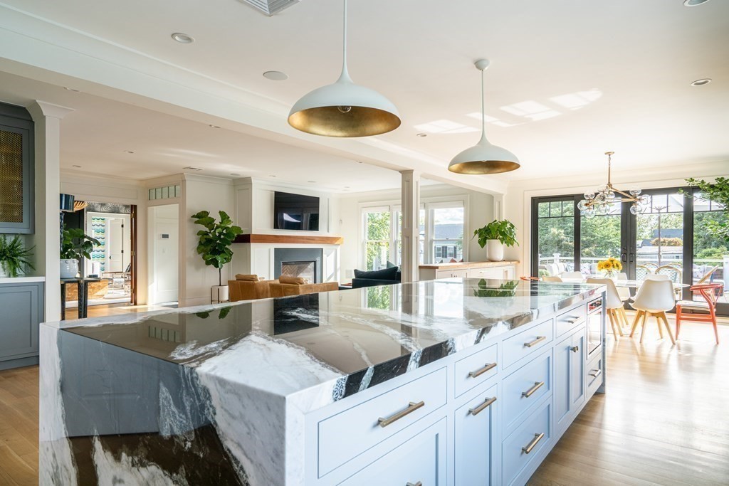21 Jarvis Avenue Hingham, MA 02043 - Photo 8 of 30 a large kitchen with a table and chairs
