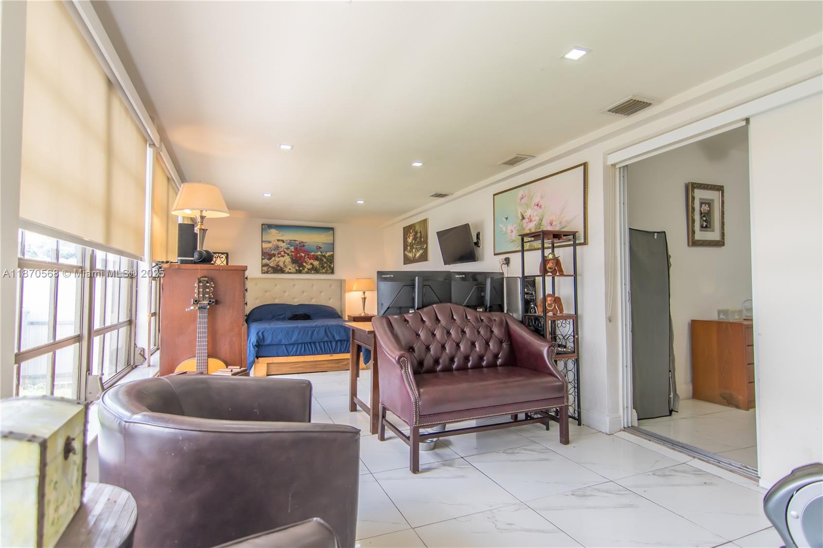 943 West 64th Place Hialeah, FL 33012 - Photo 15 of 32 a living room with furniture and a couch