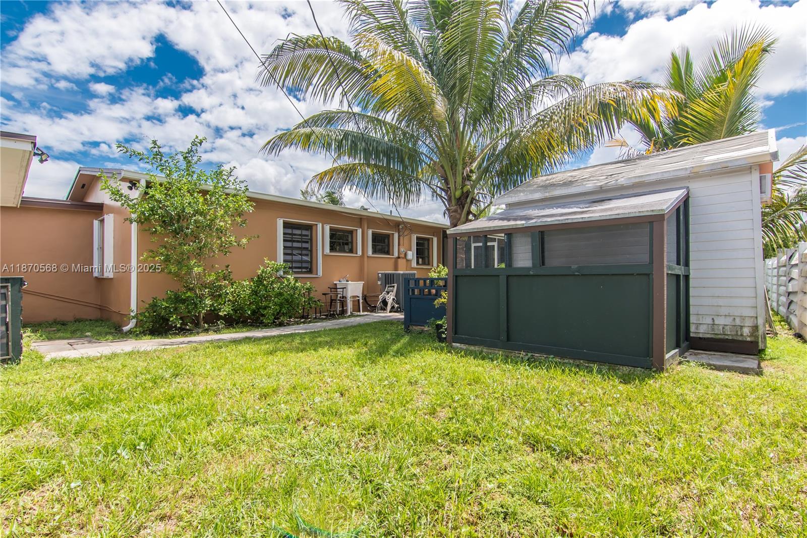 943 West 64th Place Hialeah, FL 33012 - Photo 24 of 32 a view of a house with a yard