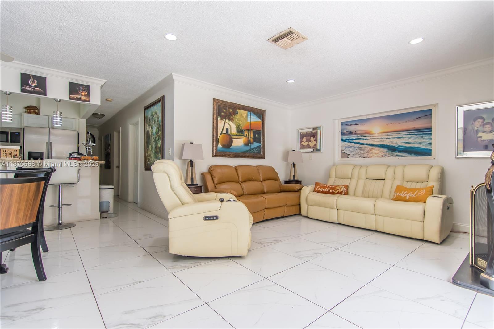 943 West 64th Place Hialeah, FL 33012 - Photo 4 of 32 a living room with furniture and a flat screen tv