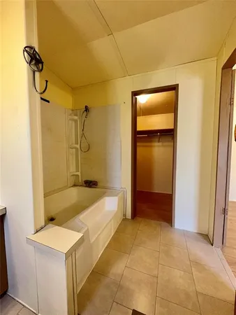 a bathroom with a sink a shower and a mirror
