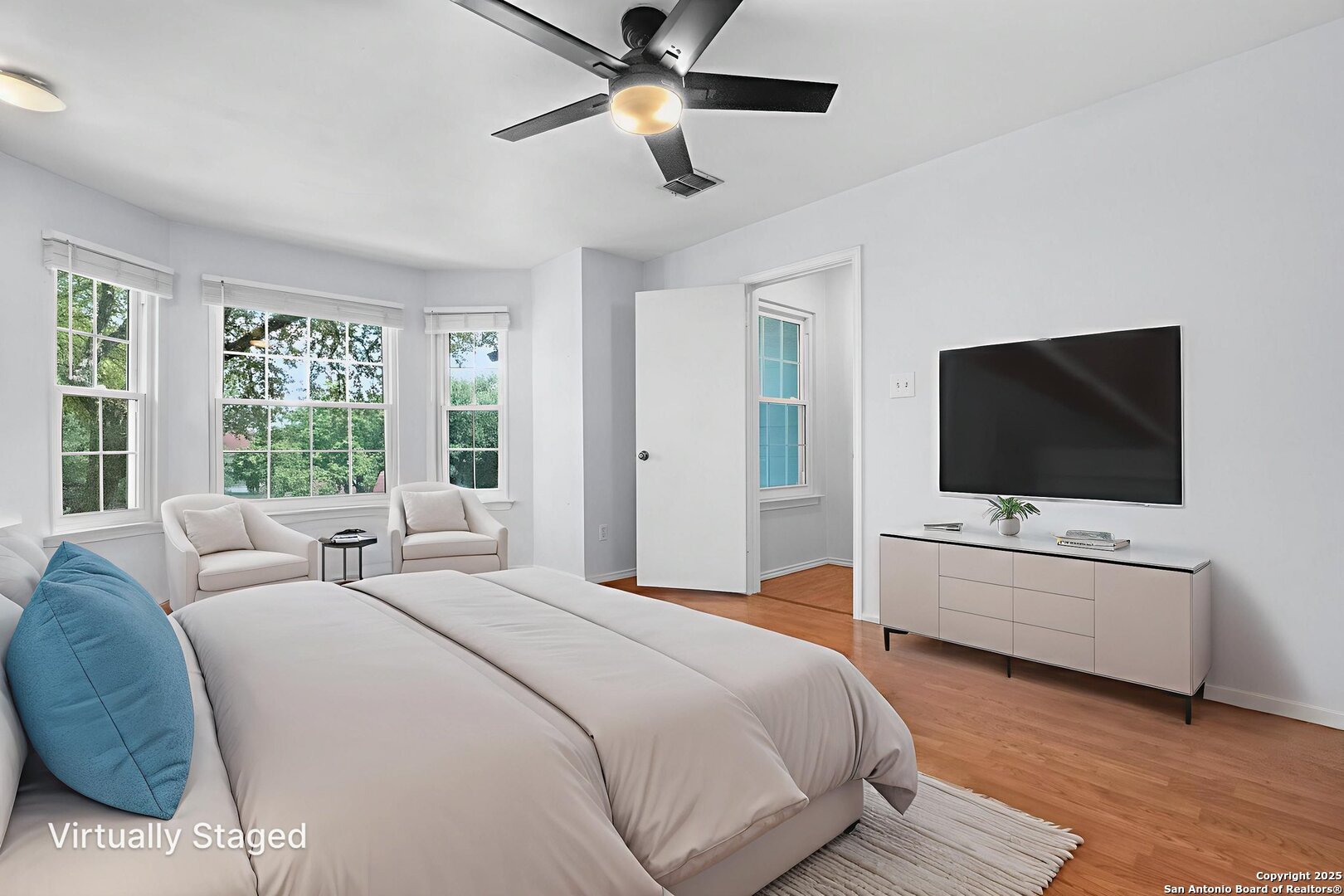 3813 Ogelthorpe Circle Schertz, TX 78154 - Photo 15 of 32 a bedroom with a bed and a flat screen tv