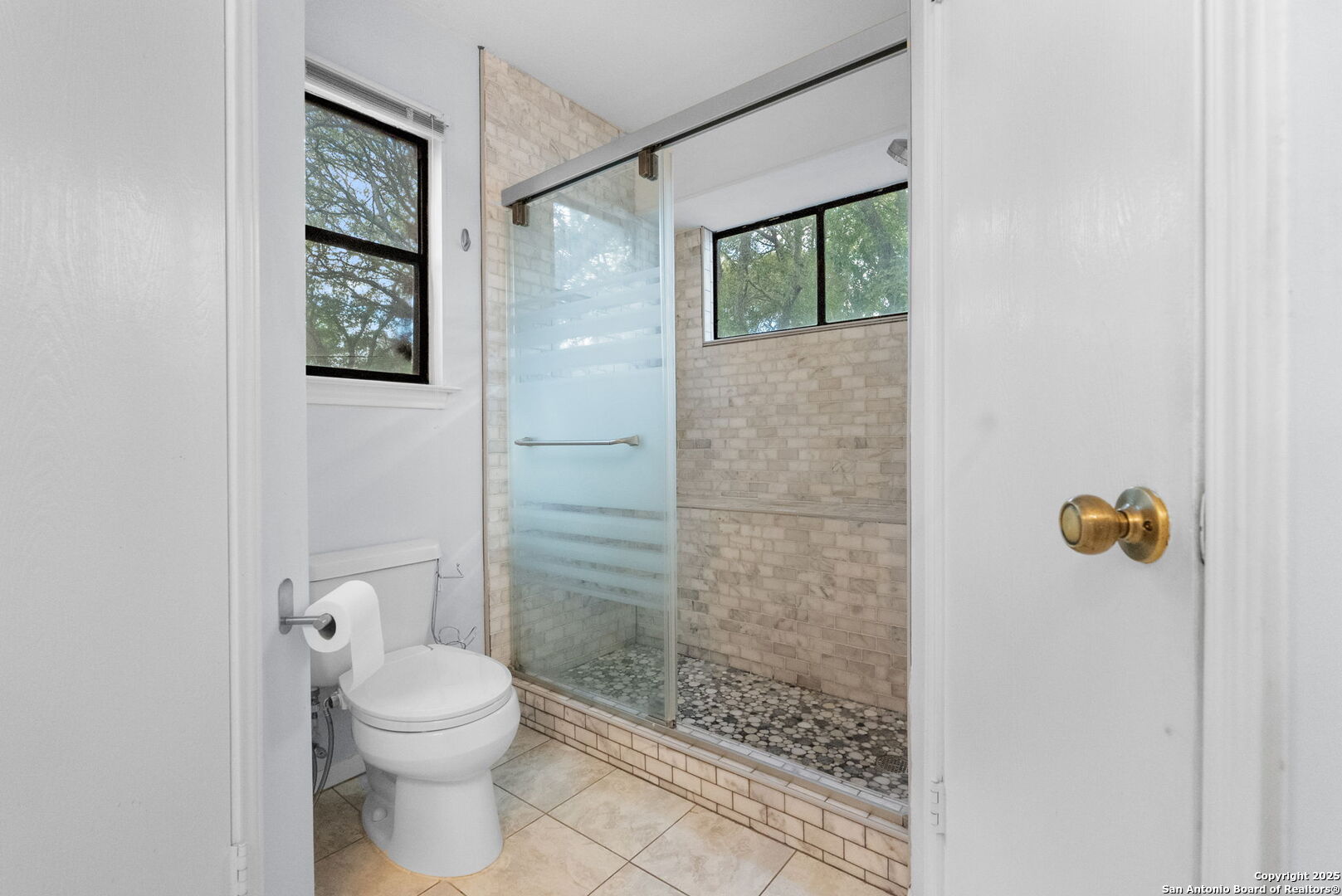 3813 Ogelthorpe Circle Schertz, TX 78154 - Photo 19 of 32 a bathroom with a toilet and a shower