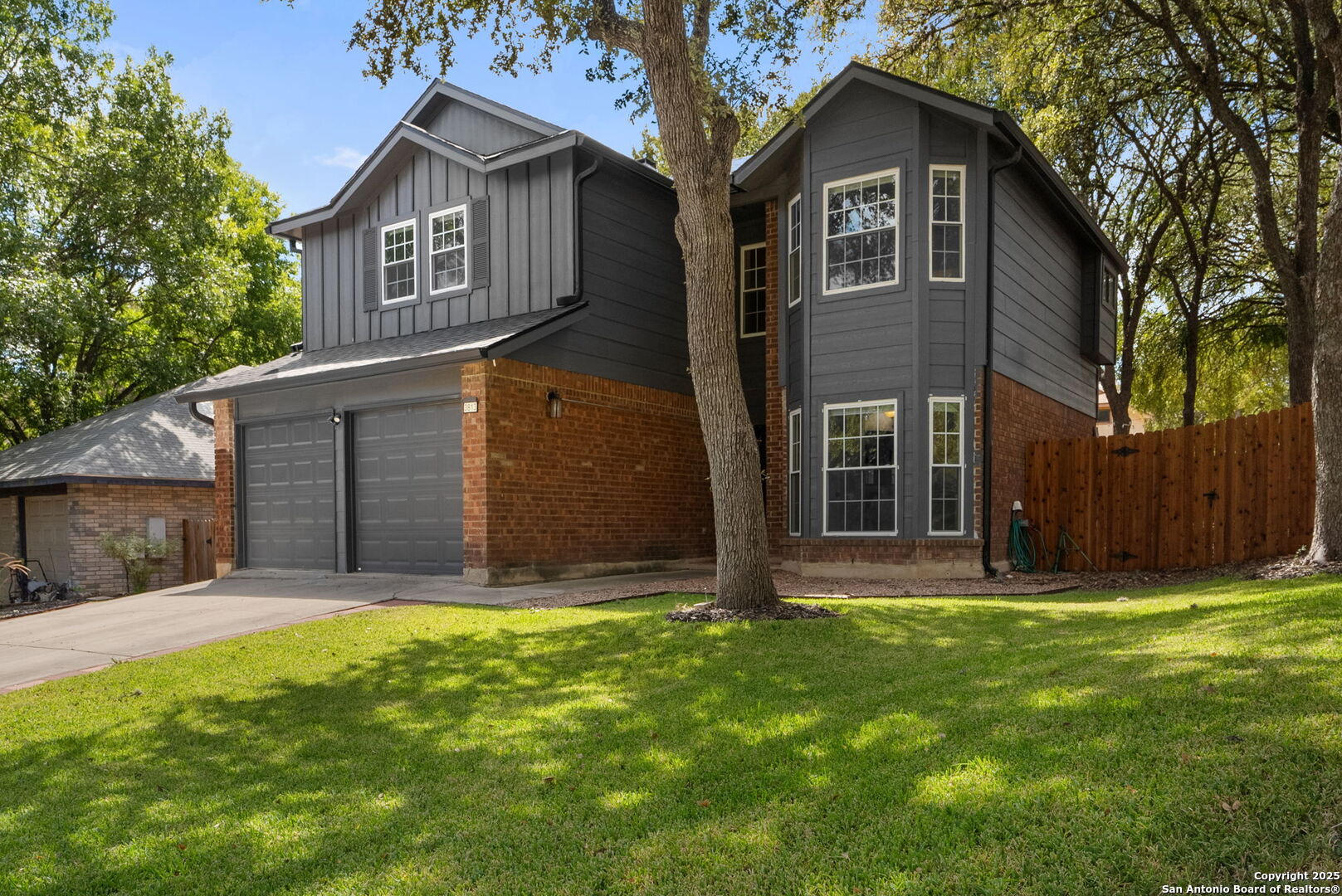 3813 Ogelthorpe Circle Schertz, TX 78154 - Photo 32 of 32 a front view of a house with a yard and garage