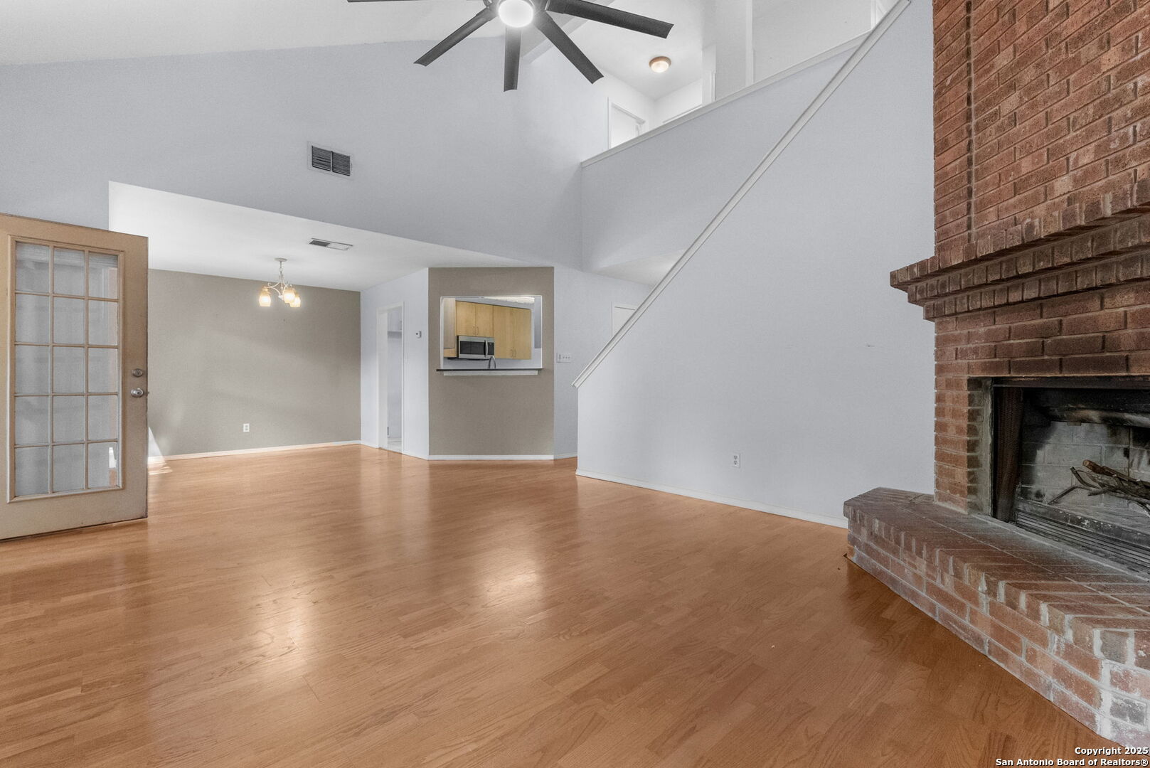 3813 Ogelthorpe Circle Schertz, TX 78154 - Photo 5 of 32 a view of a livingroom with wooden floor and a fireplace