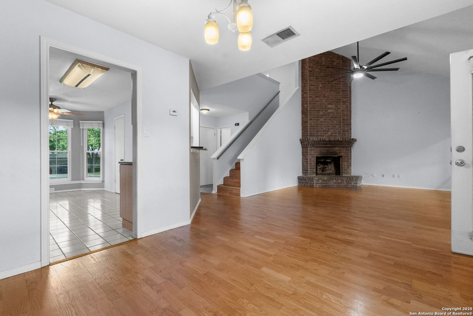 3813 Ogelthorpe Circle Schertz, TX 78154 - Photo 6 of 32 a view of an entryway with wooden floor and a livingroom view