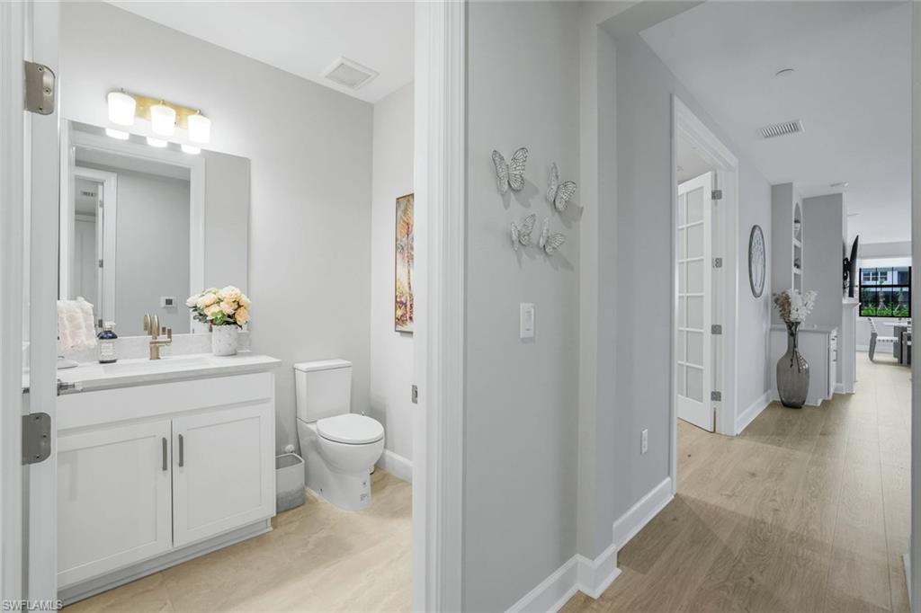 15336 Lucerna Street, Unit 104 Naples, FL 34114 - Photo 16 of 17 a bathroom with a sink toilet and shower