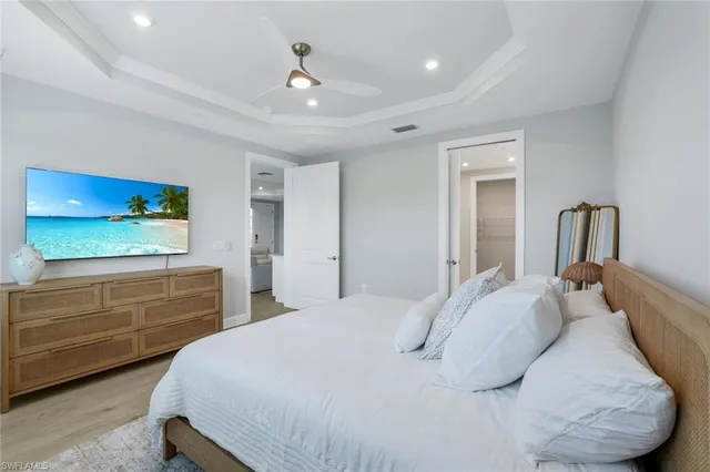 a bedroom with a bed and a dresser