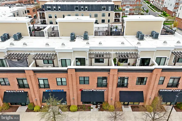 a large kitchen with stainless steel appliances granite countertop a stove and a sink