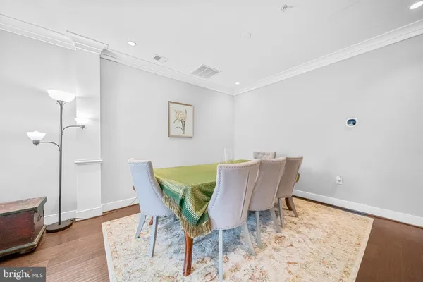 a view of staircase with railing and white walls