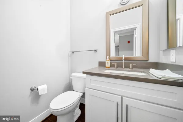 a large bed sitting in a bedroom next to a window