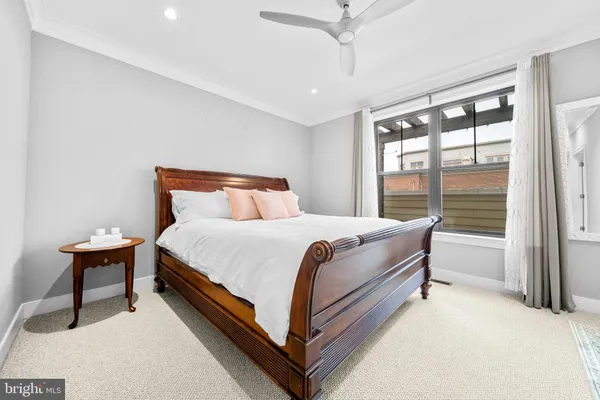 a bathroom with a granite countertop sink a toilet and bathtub