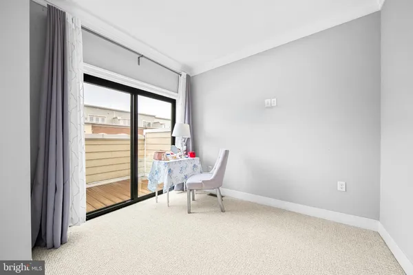 a bathroom with a granite countertop sink and a tub