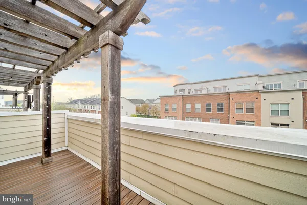 a bathroom with a granite countertop sink a mirror and a shower