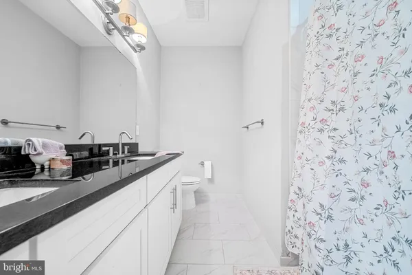 a view of outdoor space with deck and city view