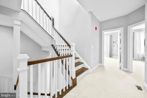 a view of a balcony with wooden floor